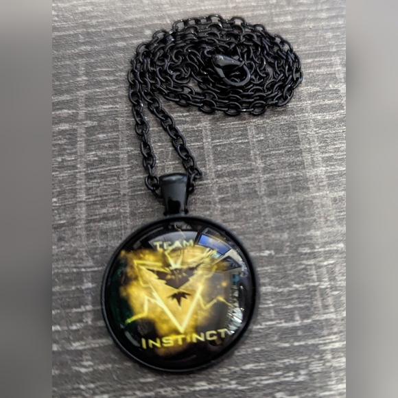 Pokemon Team Instinct Necklace, NWOT - Picture 2 of 3